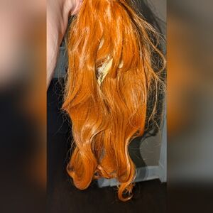 4 synthetic wigs, 1 short blue, 2 red, 1 black all new except 1 of the red ones